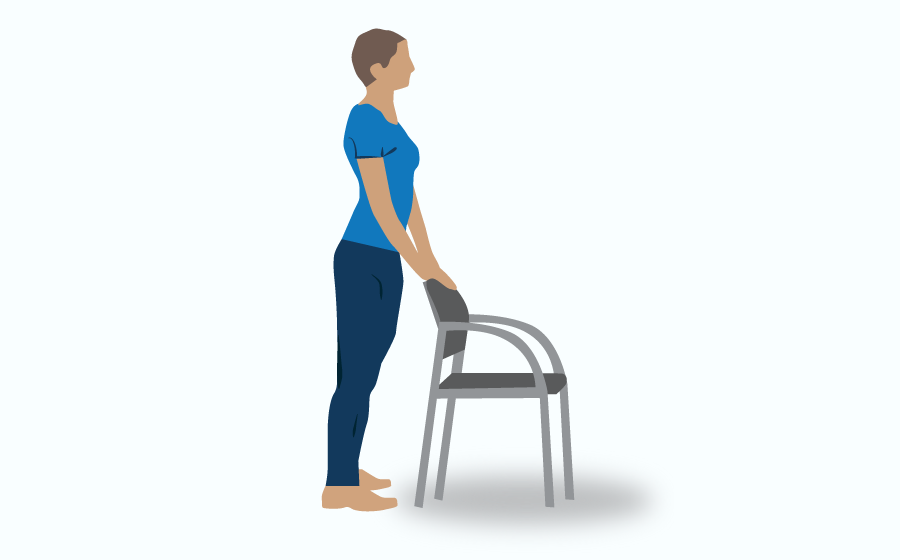 Person standing, holding back of chair