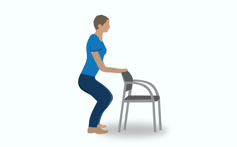 Person semi-squatting while holding chair