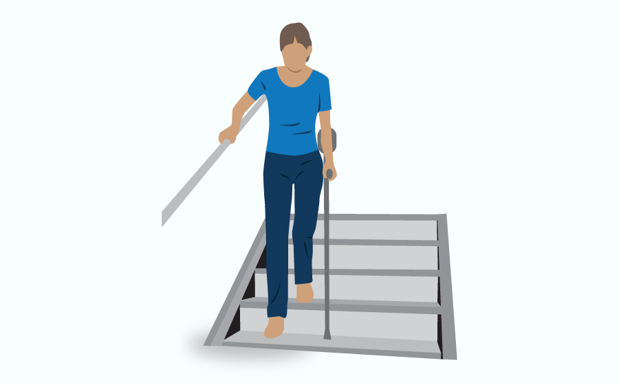 Person coming down the stairs, using a crutch