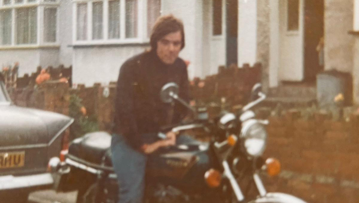 Mike Rose, who received life-saving emergency surgery at Heartlands Hospital, seated on his motorcycle