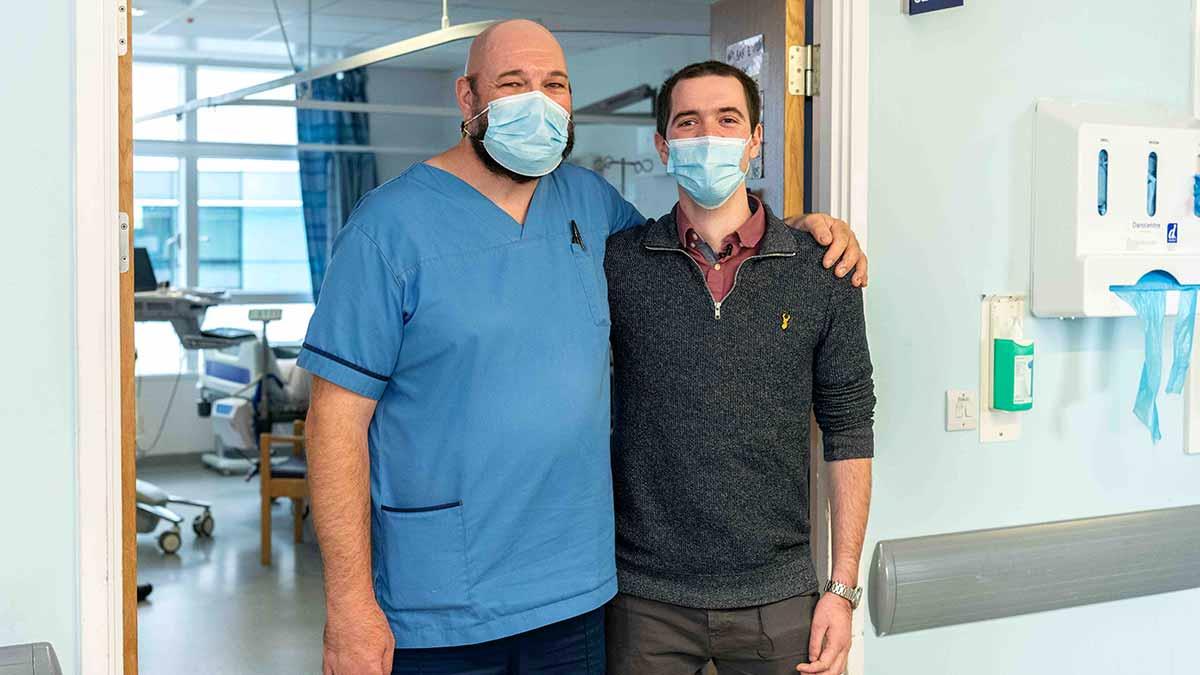 Former coma patient Aodhan Cunningham visits staff Nurse Frazer, who looked after him on Ward 409 at QEHB