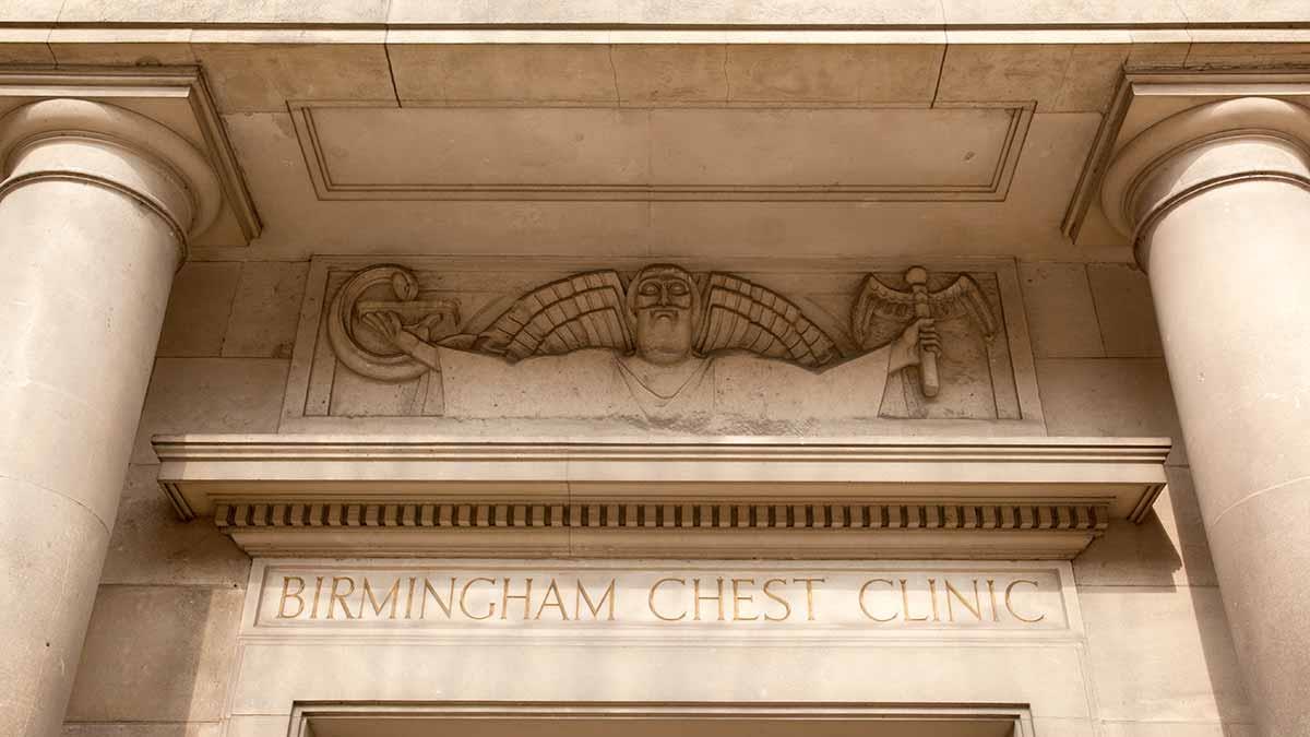 The entrance to the historic Birmingham Chest Clinic features ornate carving and Tuscan columns.