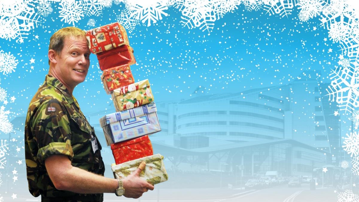 Soldier with Christmas presents outside Queen Elizabeth Hospital Birmingham