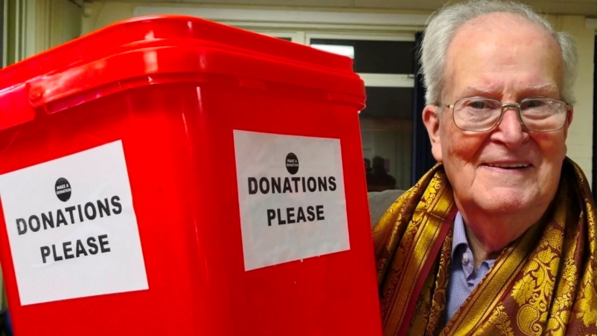 Des Rafferty with a donation box