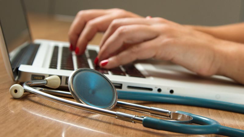 Medical staff using laptop